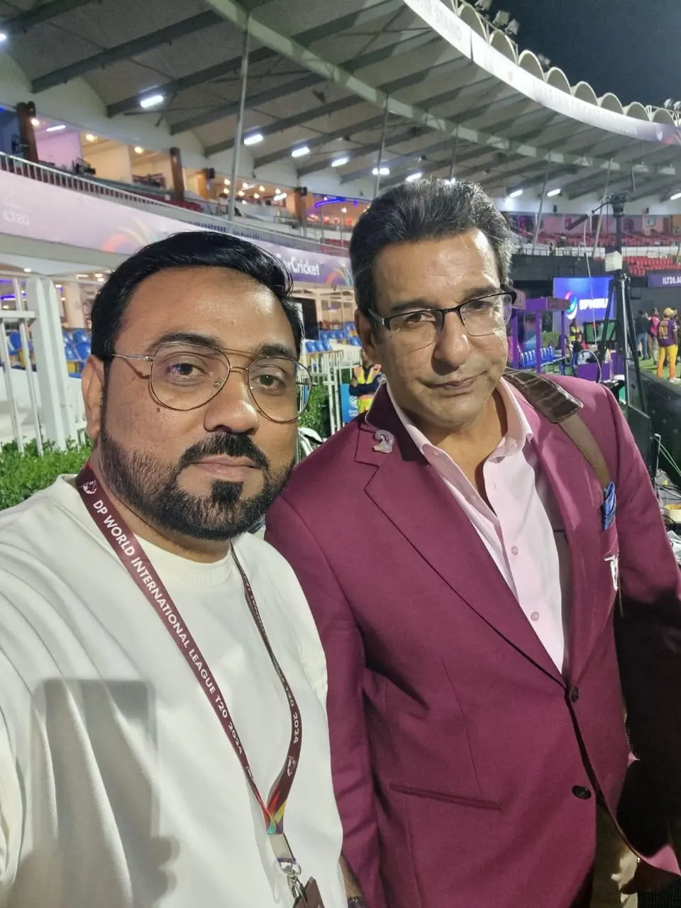 Gulf Media representative networking with Wasim Akram at an international sports event