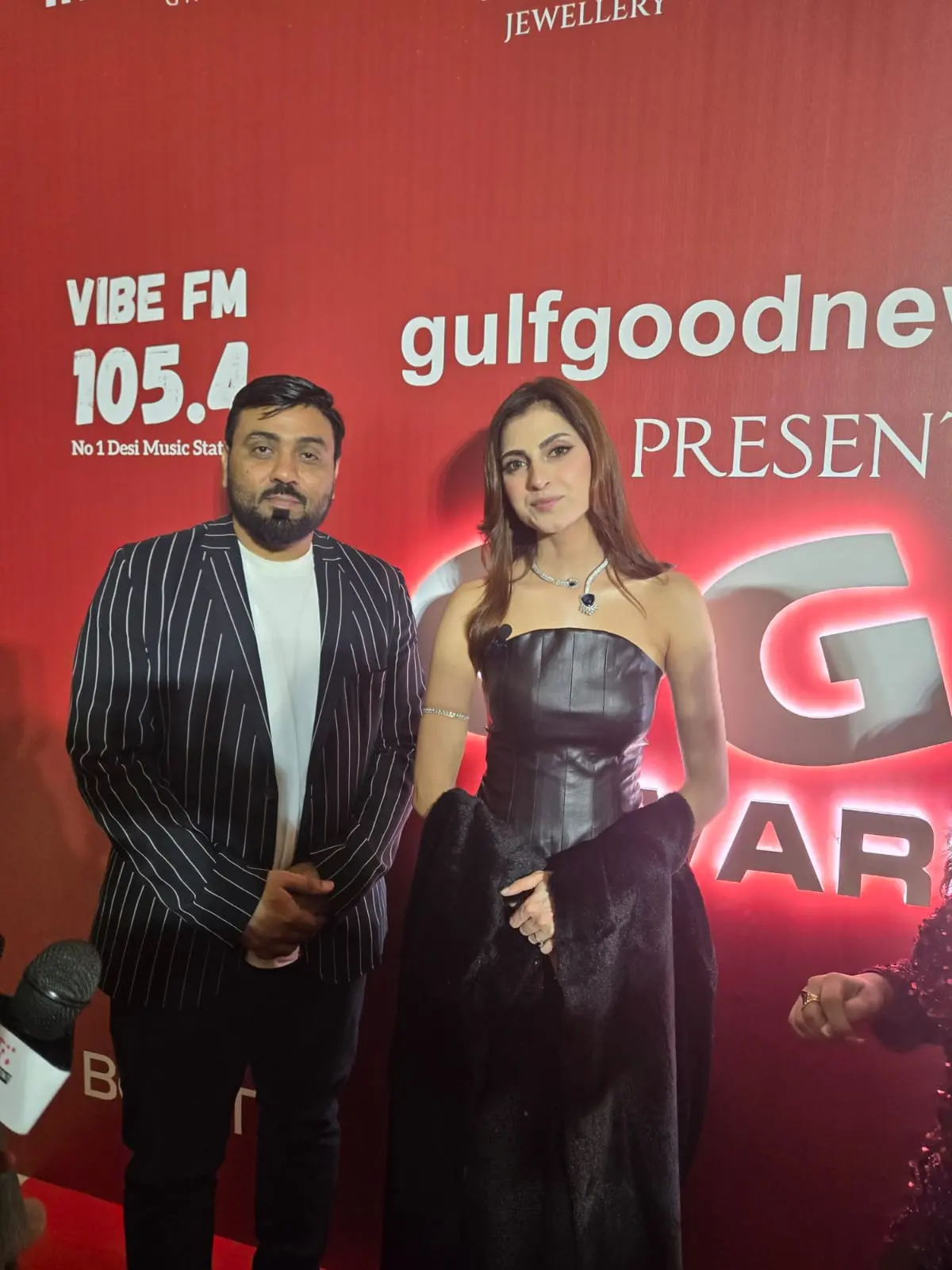 Gulf Media representative at a red-carpet press and entertainment event